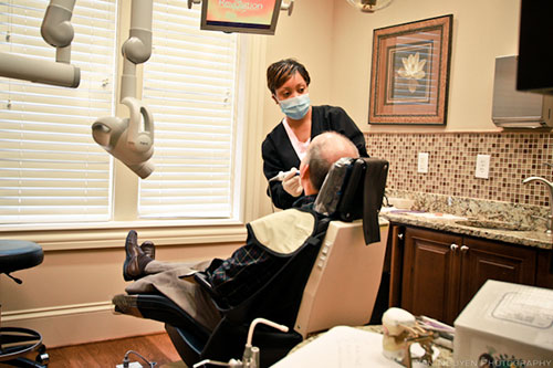 Assistant operates patient at Reich Dental Center in Smyrna, GA